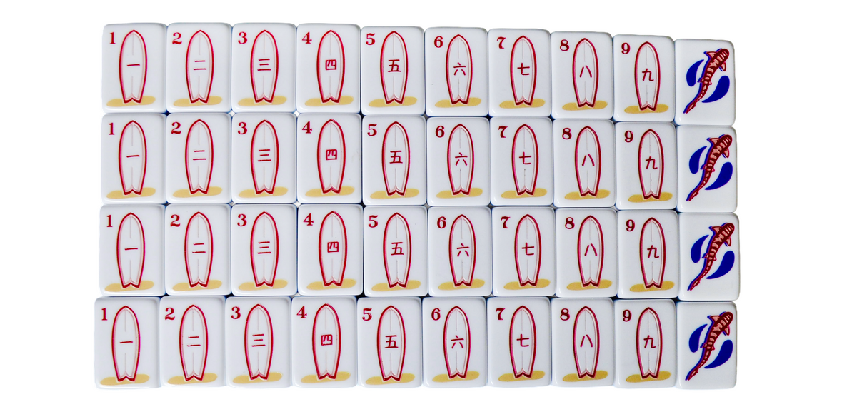 The La Jolla Tiles coastal mahjong set featuring surfboards as craks; surfboards as cracks. 